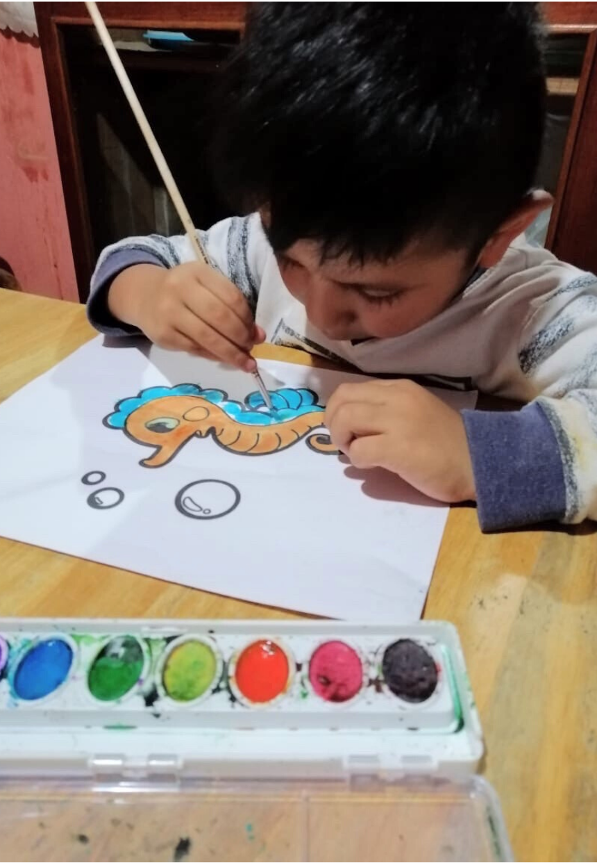 GoodNews2 Maya Childcare student painting a picture at home